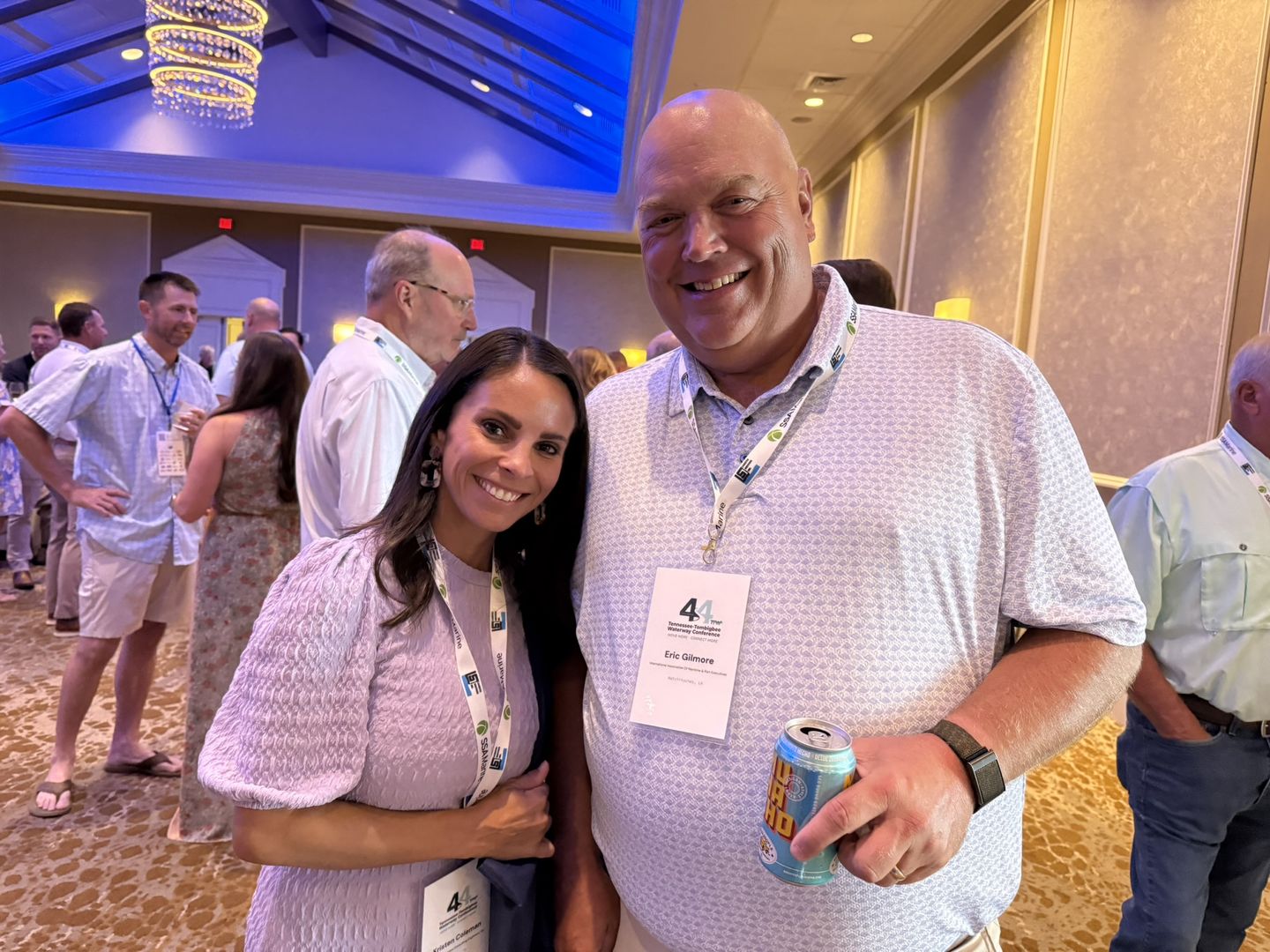 Two attendees smile at the evening reception.