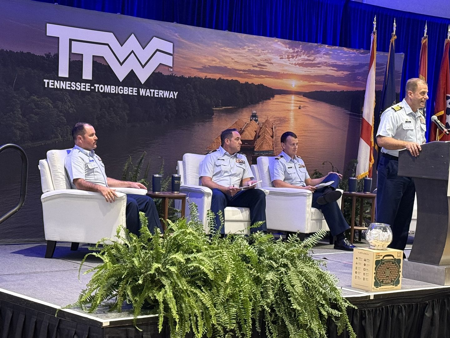 A Coast Guard panel seated on stage.